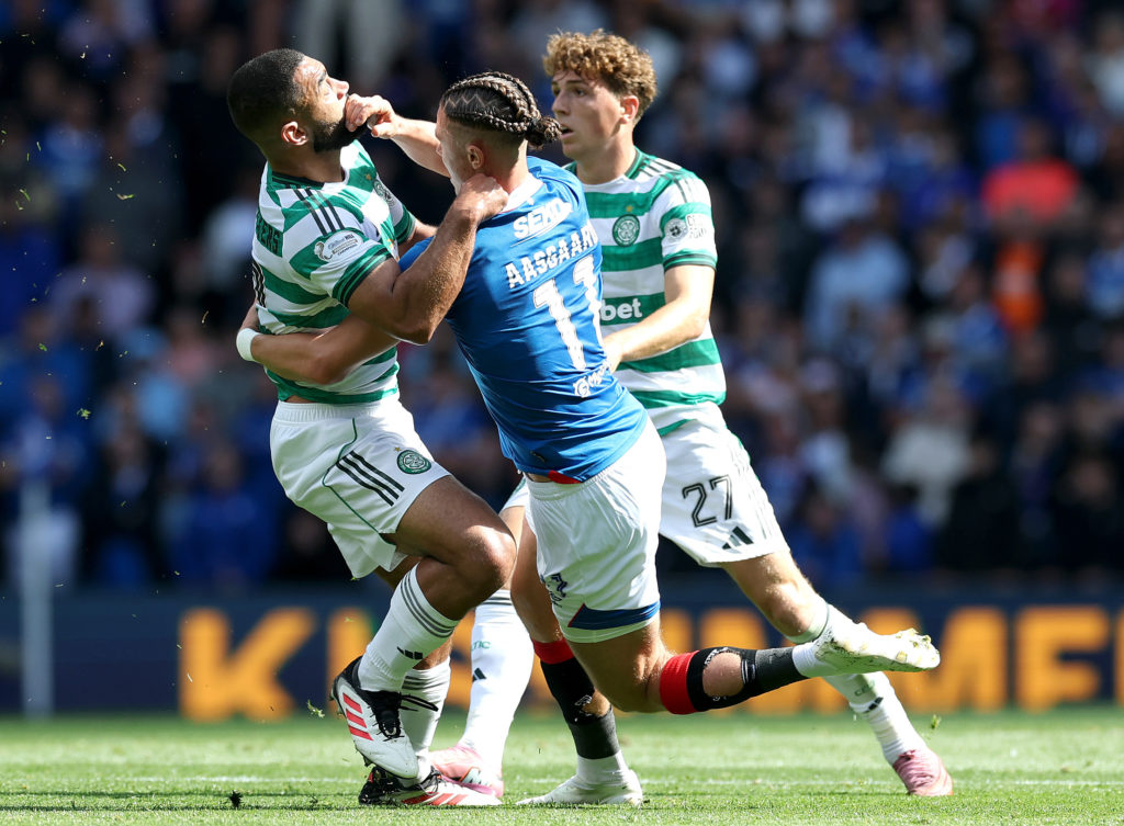 Cameron Carter-Vickers of Celtic clashes with Thelo Aasgaard of Rangers