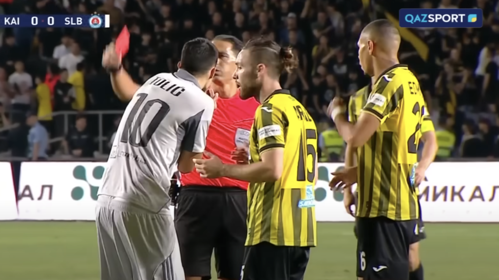 Slovan Bratislava player is sent off by the referee against Kairat Almaty during Champions League qualifier