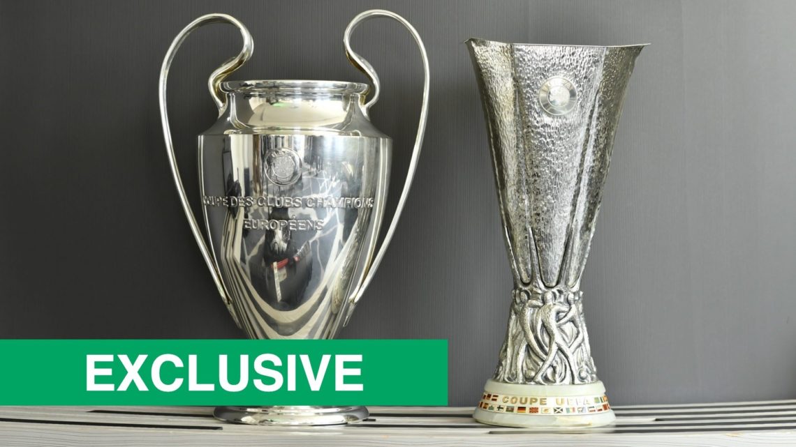 Detailed view of the Champions League and Europa League trophies side by side