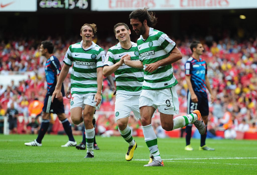 Georgios Samaras of Celtic (9) is congratulated by team mates Milan Misun (L) and Gary Hooper after equalising during the Emirates Cup match between Celtic and Lyon at Emirates Stadium