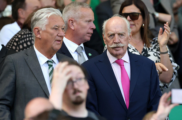 Dermot Desmond, Shareholder of Celtic FC (R) looks on from the stands prior to the William Hill Premiership match between Celtic FC and St Mirren FC at Celtic Park