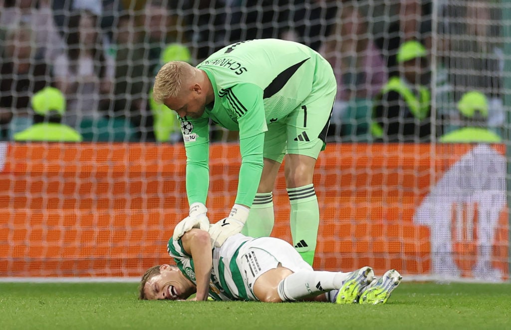 Alistair Johnston of Celtic lies injured during the UEFA Champions League Play-offs Round First Leg match between Celtic and Kairat Almaty