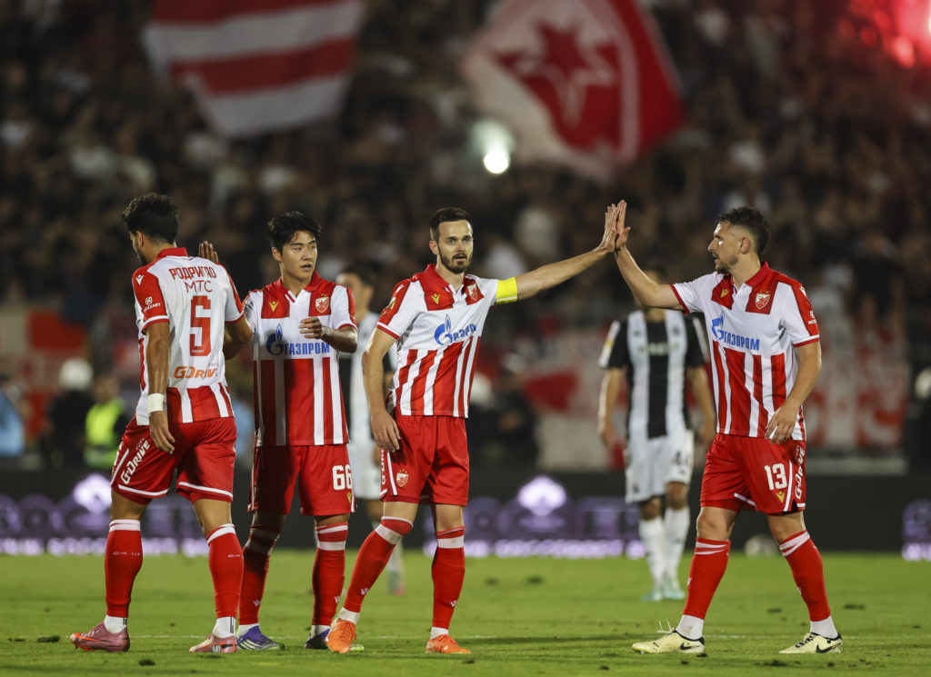 Mirko Ivanic of Red Star Belgrade embraces his teammate against Partizan Belgrade