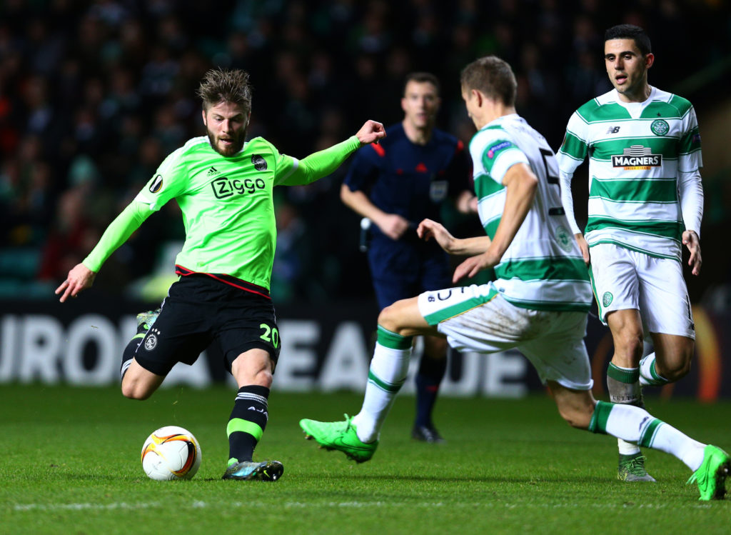 Lasse Schone of Ajax has his shot on goal charged down by Jozo Simunovic of Celtic during the UEFA Europa League Group A match