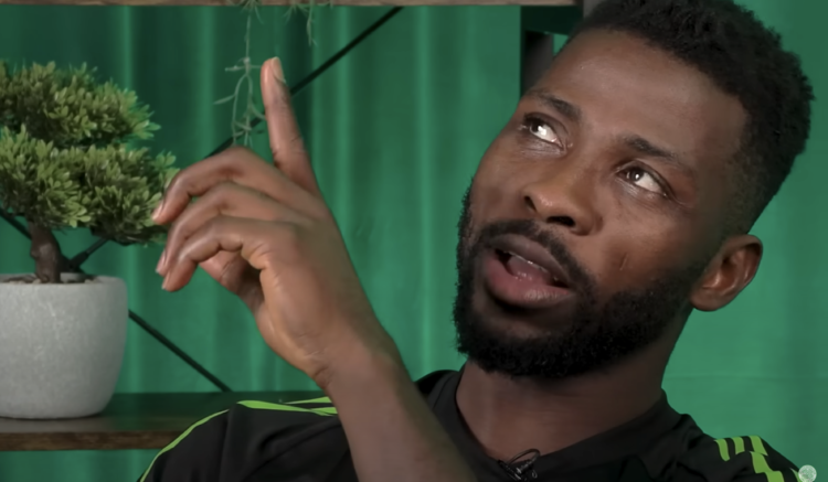 Kelechi Iheanacho points upwards during Celtic TV interview in September 2025