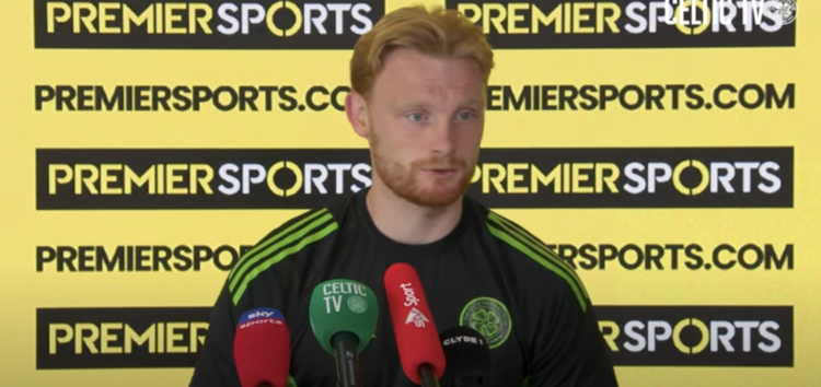 Liam Scales answers questions during a Celtic press conference
