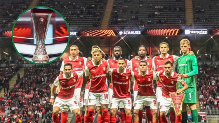The Braga squad pose for a photo before the Europa League tie vs Feyenoord, an inset of the Europa League trophy on the stage