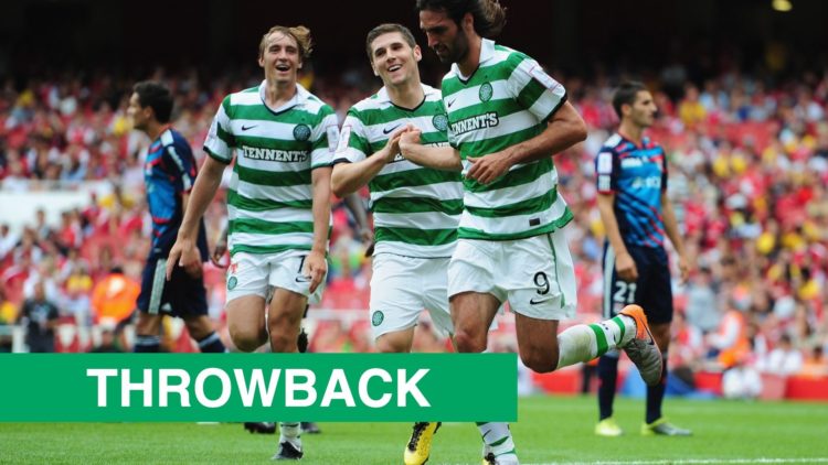 Georgios Samaras celebrates a goal for Celtic at the Emirates Stadium vs Lyon in 2010 with 'Throwback' banner bottom left