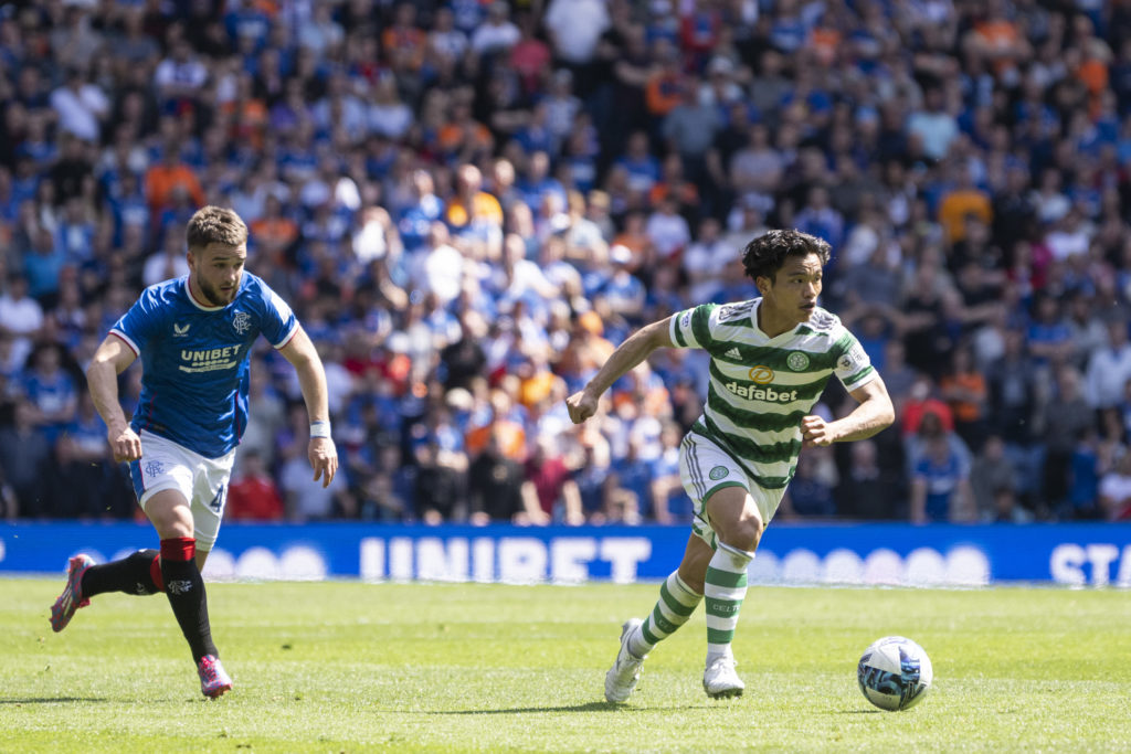 Reo Hatate of Celtic on the ball chased by Nicolas Raskin of Rangers during Cinch Premiership match between Rangers and Celtic at Ibrox Stadium