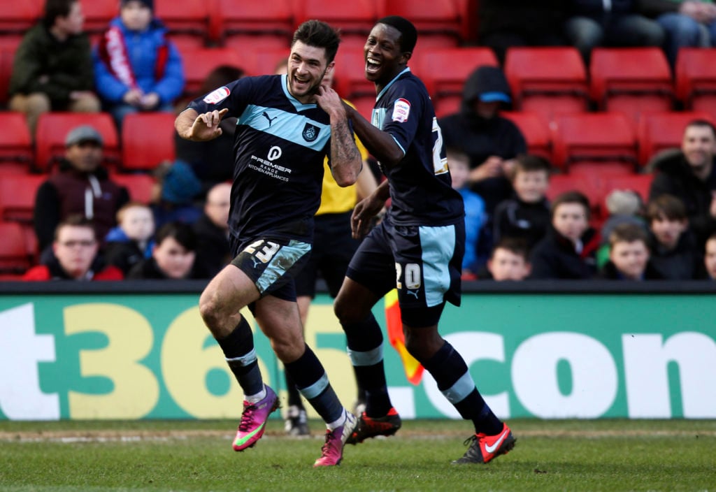 Charlie Austin of Burnley (L) celebrates with Marvin Bartley of Burnley after scoring the opening goal of the game during the npower Championship match between Charlton Athletic and Burnley at the Valley