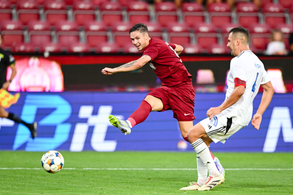 Louis Munteanu takes a shot during CFR Cluj v FC Botosani