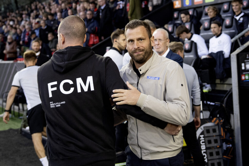 Sturm Graz's Austrian coach Jurgen Saumel greets Midtjylland's Danish coach Mike Tullberg before the UEFA Europa League first round