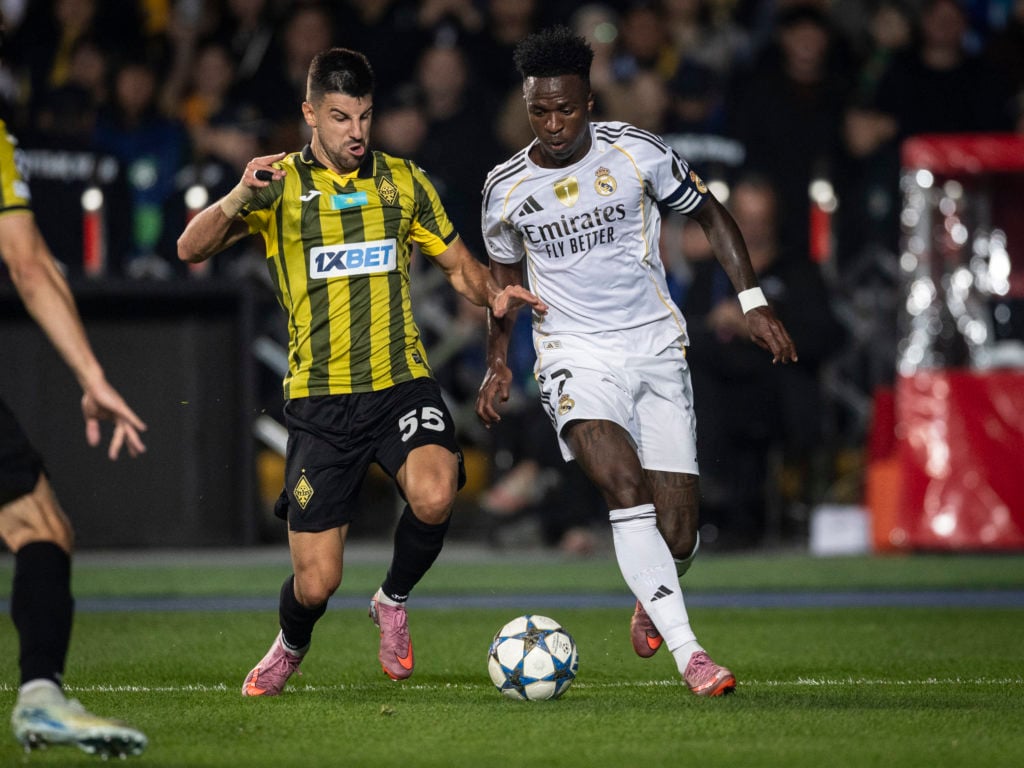Vinícius Júnior of Real Madrid C.F. (R) and Valery Gromyko of FC Kairat Almaty (L) fight for possession