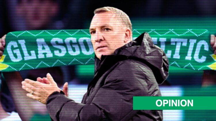 Brendan Rodgers applauds with a Celtic fan holding up a scarf in the background.