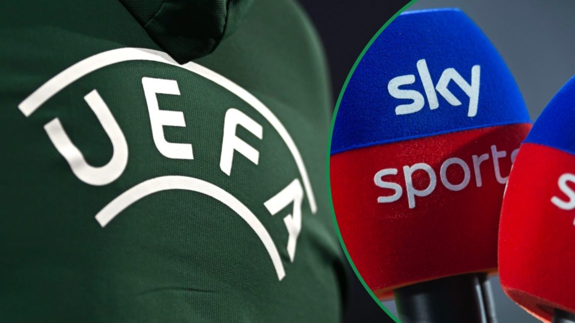 UEFA logo seen on referee's back left and Sky Sports microphones right