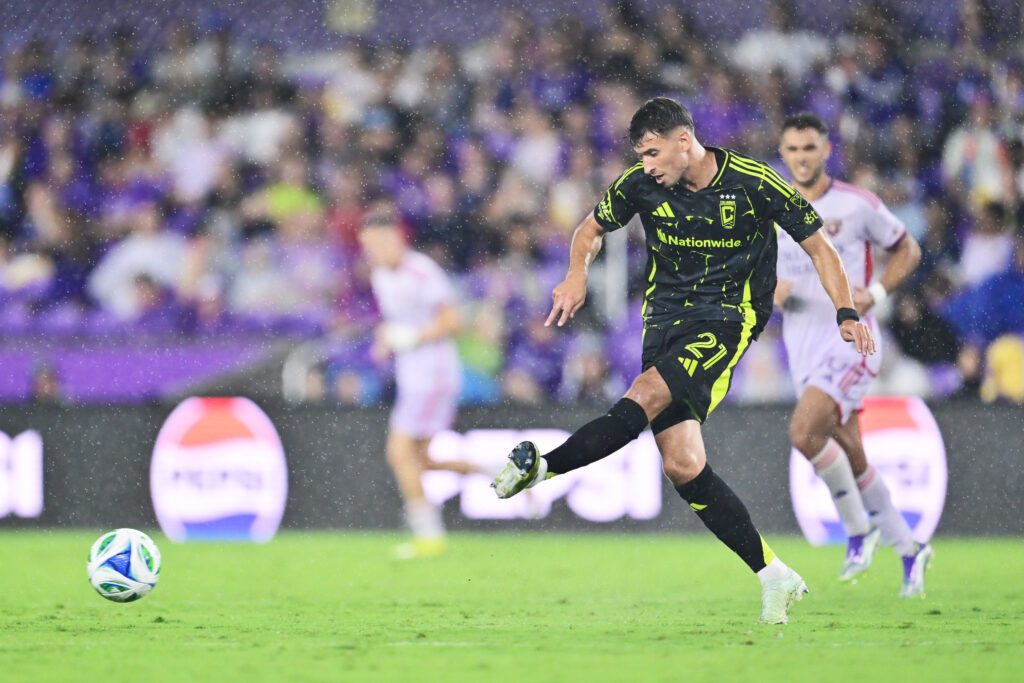 Yevhen Cheberko passes the ball during the MLS clash between Orlando City v Columbus Crew