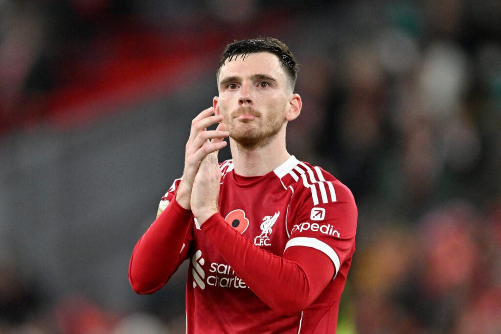 Andy Robertson applauds Liverpool fans after the win against Aston Villa