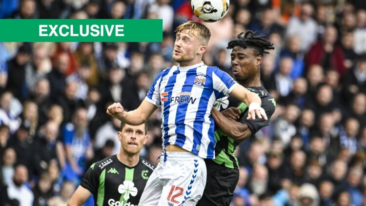 David Watson challenges for the ball for Kilmarnock against Cercle Brugge.