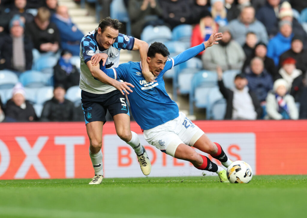 Liam Henderson of Falkirk tussles with Bojan Miovski of Rangers
