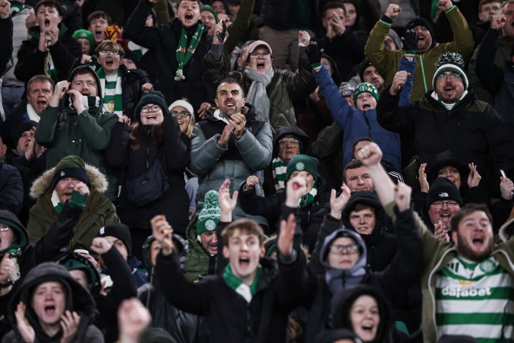 Celtic fans cheer on the side against Roma in the Europa League