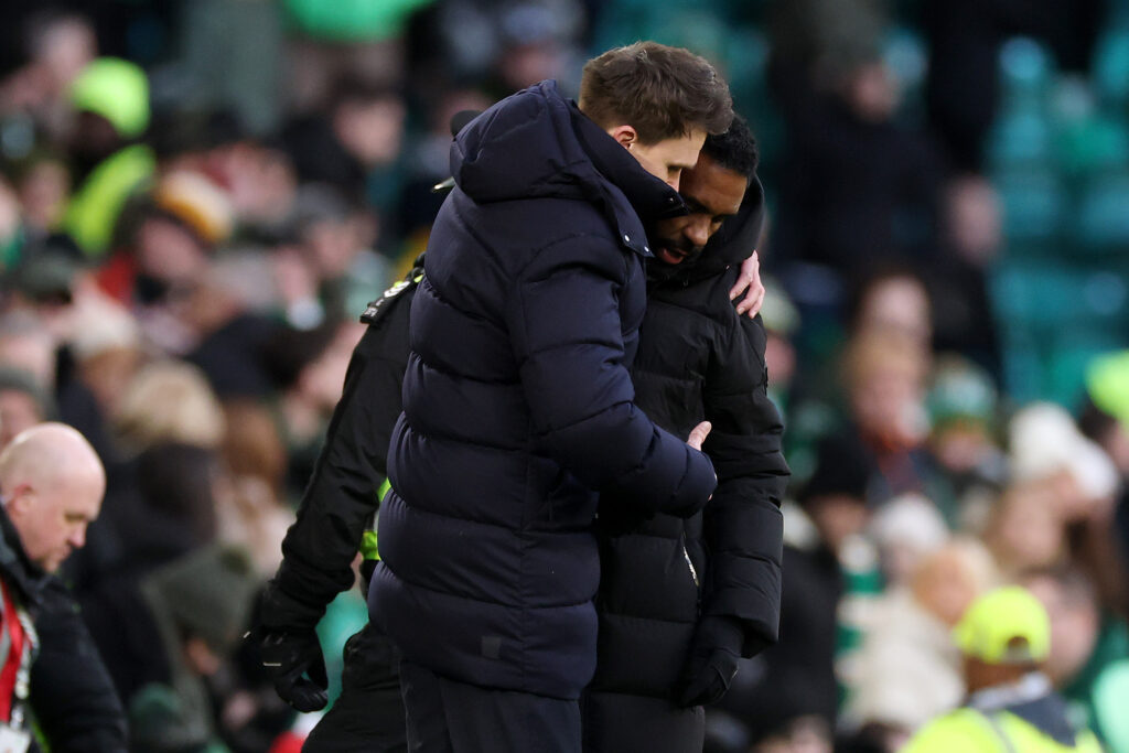 Danny Rohl, Head Coach of Rangers, and Wilfried Nancy, Head Coach of Rangers, embrace following the Premier League match between Celtic and Rangers