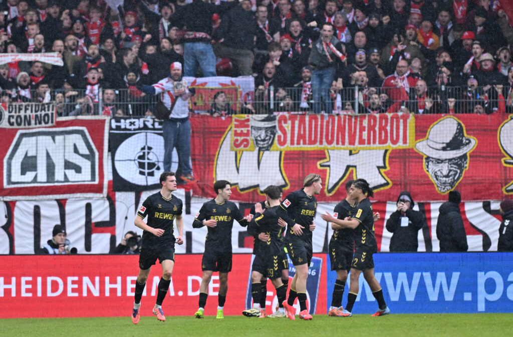 Jahmai Simpson-Pusey celebrates with his FC Koln teammates against FC Heidenheim 1846 in the Bundesliga.