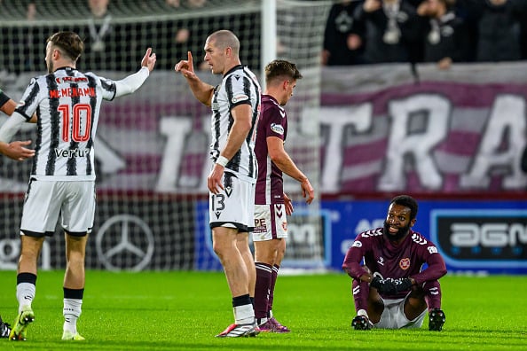 Beni Baningime of Hearts (R) looks concerned before he is shown a red card by referee Kevin Clancy during the Premier League match between Heart of Midlothian and St Mirren
