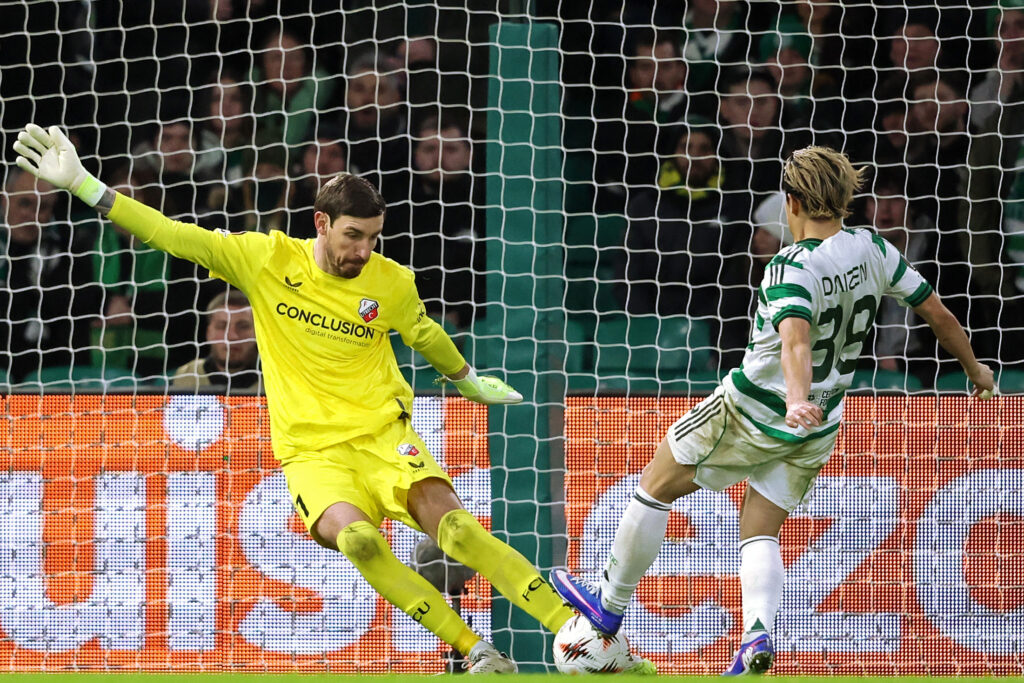 Daizen Maeda tries to tackle Vasilis Barkas in the Europa League