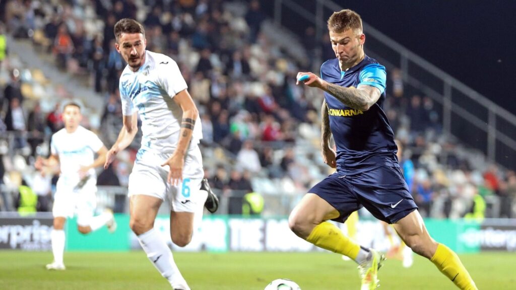 Franko Kovacevic of Celje is chased by Stjepan Radeljić of HNK Rijeka