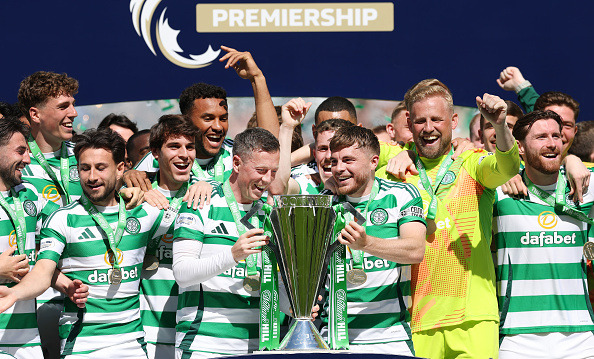 Callum McGregor and James Forrest of Celtic lift the League trophy