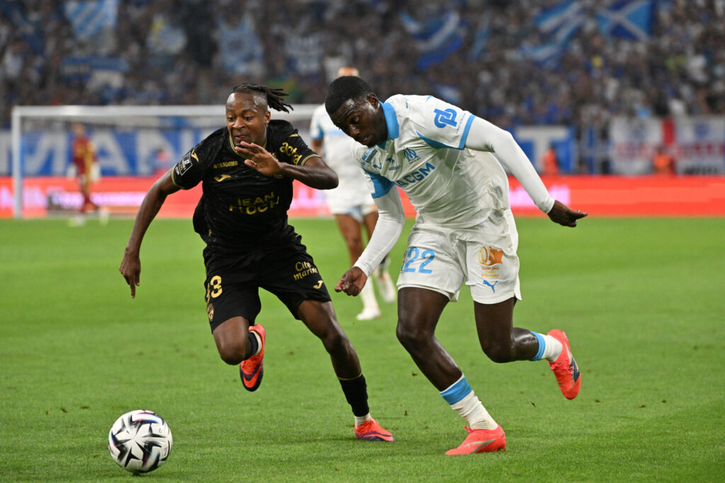 Lorient winger Joel Mvuka and Marseille's Timothy Weah challenge for the ball during their Ligue 1 encounter.