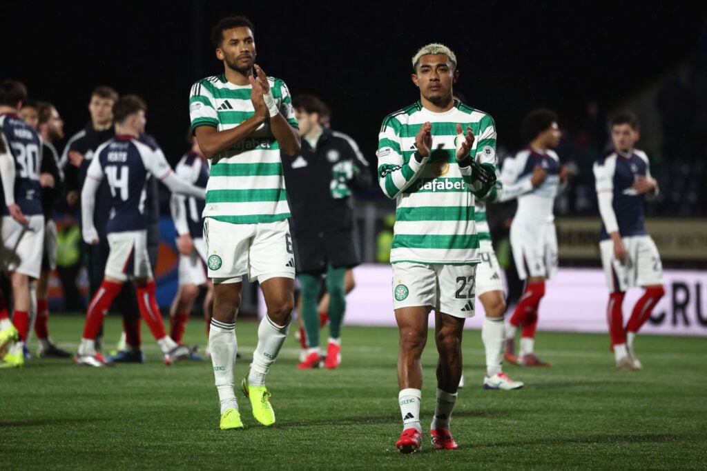 Auston Trusty of Celtic and Julian Araujo of Celtic applaud their fans