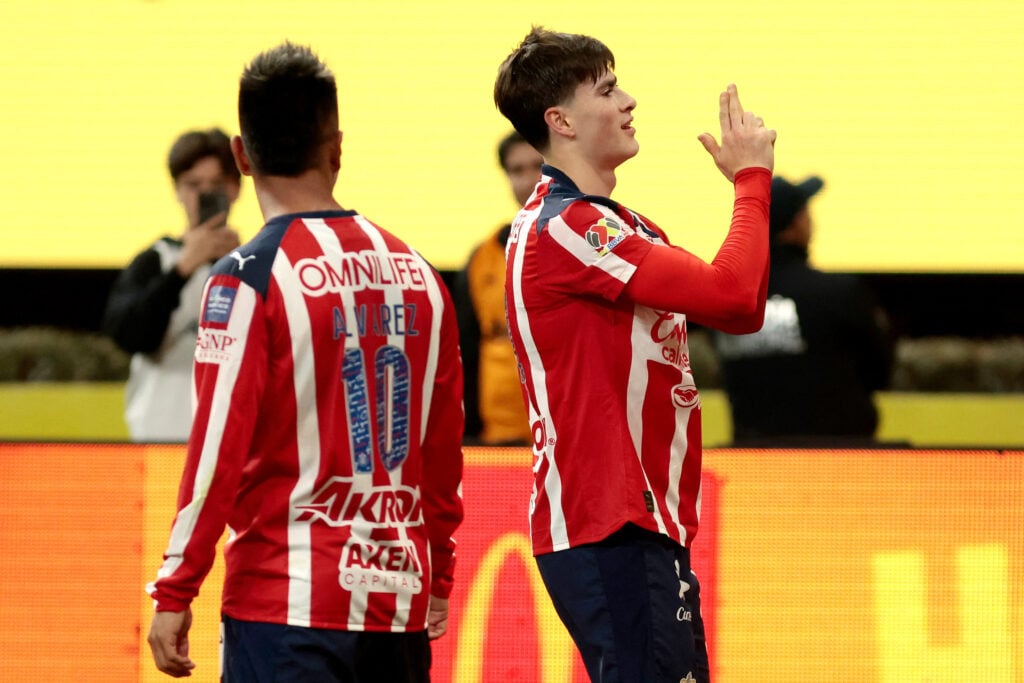 Armando Gonzalez (R) celebrates scoring his team's first goal during the Liga MX Clausura tournament football match between Guadalajara and America