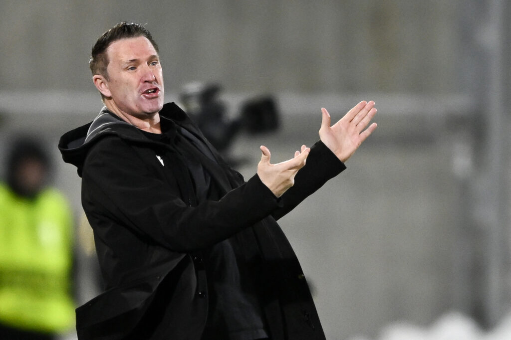Ferencvaros' Irish coach Robbie Keane gestures from the techincal area during the UEFA Europa League - knockout round play-off first leg - football match between PFC Ludogorets Razgrad and Ferencvarosi TC