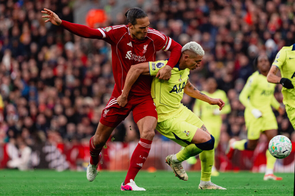 Virgil van Dijk tussles for the ball with Richarlison during Liverpool v Tottenham Hotspur in the Premier League