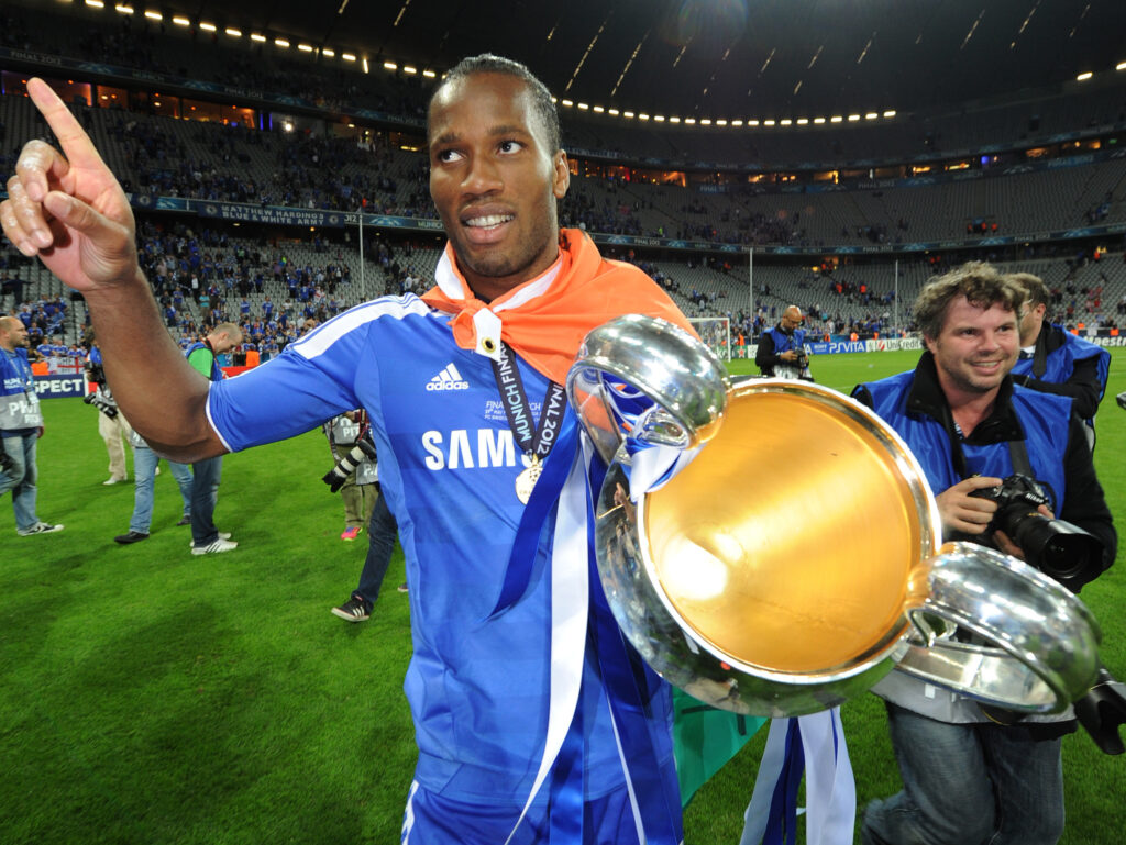 Chelsea's Ivorian forward Didier Drogba holds the trophy after the UEFA Champions League final football match between FC Bayern Muenchen and Chelsea FC