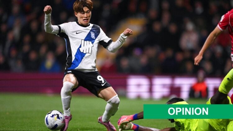 Kyogo Furuhashi of Birmingham City is challenged by Arthur Okonkwo of Wrexham AFC during the Sky Bet Championship match between Wrexham AFC and Bir...
