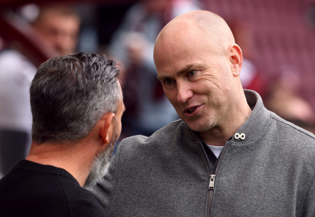 Derek McInnes, Manager of Heart of Midlothian, and Jens Berthel Askou, Manager of Motherwell, talk prior to the William Hill Premiership match between Heart of Midlothian and Motherwell
