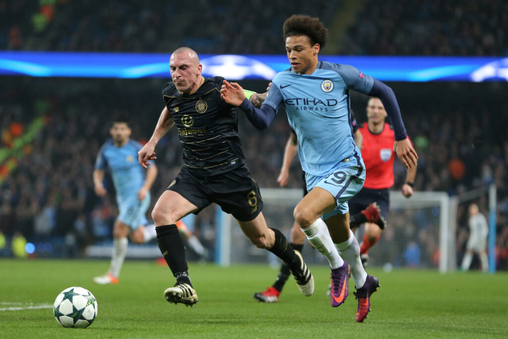 Leroy Sane of Manchester City competes with Scott Brown of Celtic during the UEFA Champions League match between Manchester City FC and Celtic FC