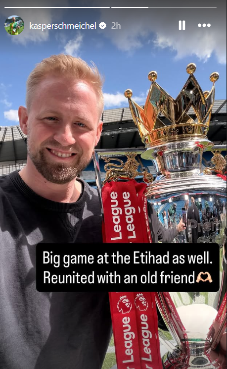 Kasper Schmeichel poses with the Premier League trophy at the Etihad Stadium for Manchester City vs Arsenal