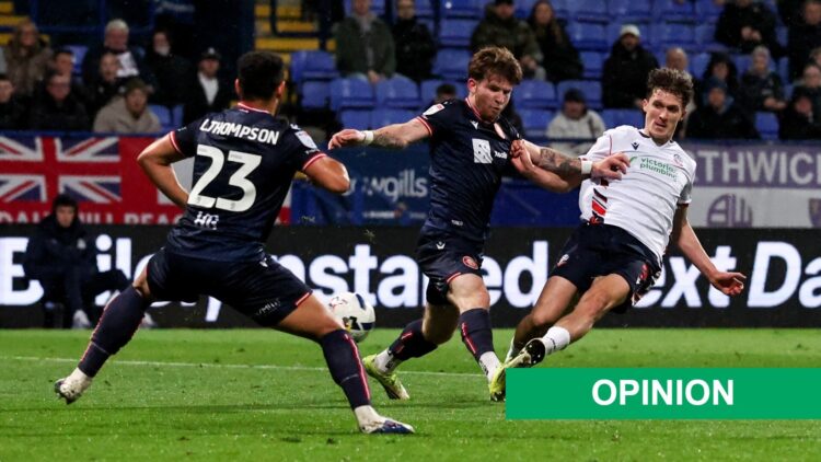 Bolton Wanderers' Johnny Kenny shoots for goal under pressure from Stevenage's Jasper Pattenden and Louis Thompson during the Sky Bet League One ma...