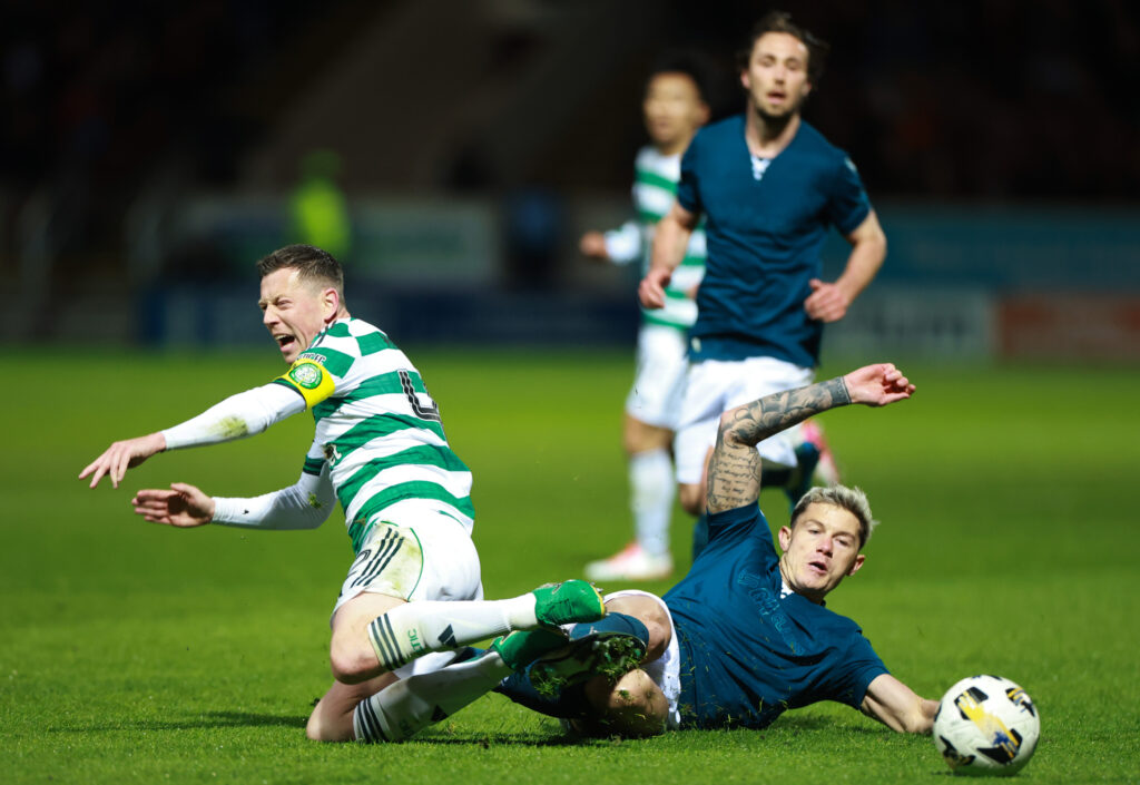Callum McGregor is tackled during Celtic's clash against Motherwell in the Premiership at Fir Park.