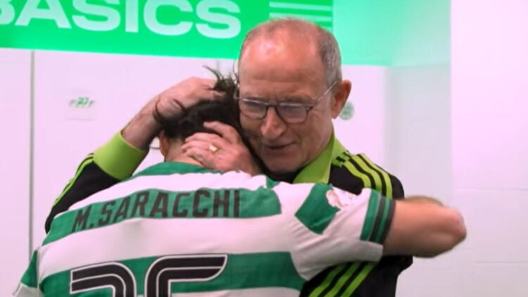 Martin O'Neill embraces Marcelo Saracchi in the Celtic changing rooms after Celtic's win against Hearts