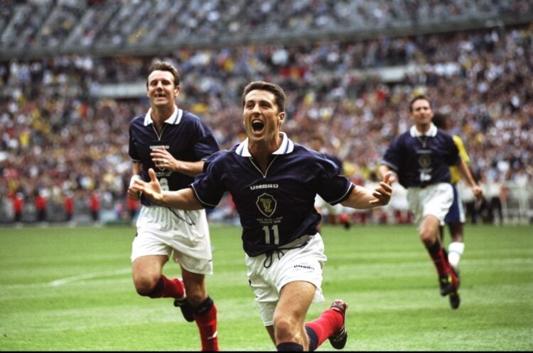 10 Jun 1998: John Collins of Scotland celebrates after scoring from the penalty spot during the World Cup group A game against Brazil at the Stade...