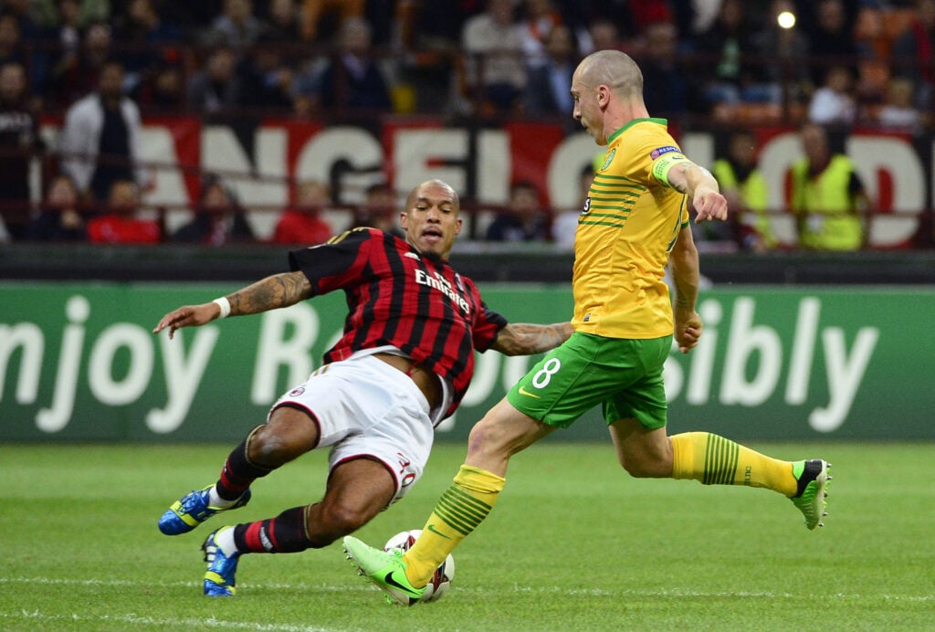 Scott Brown challenges for the ball during Celtic's Champions League clash against AC Milan.